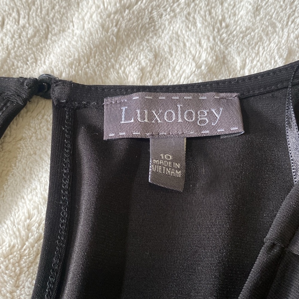 Black Dressy Romper With Pockets And Gold Color Buttons - Picture 5 of 7